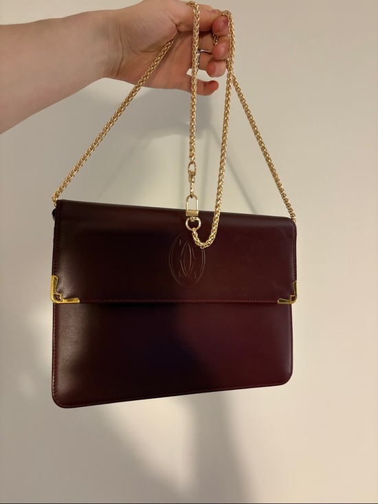 Cartier Other - Cartier Burgundy Leather wristlet with Gold Corners